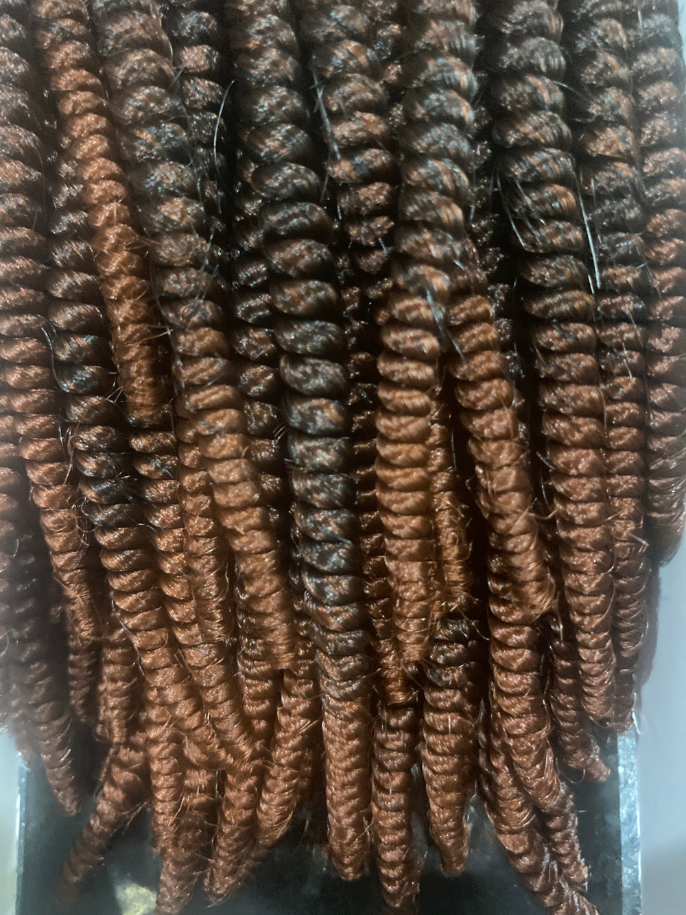 Brown and black crochet hair.
