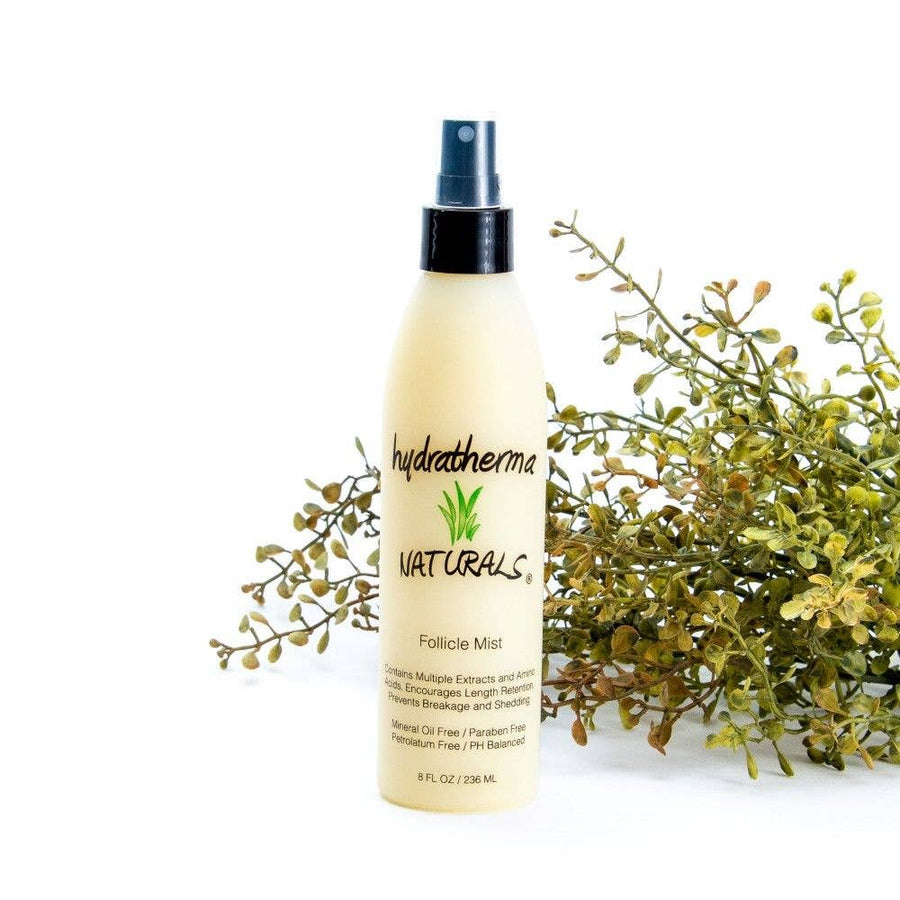 A bottle of Hydratherma Naturals Follicle Mist, with a spray nozzle and label detailing ingredients.