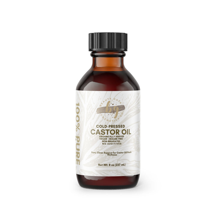Brown bottle of cold-pressed castor oil with black cap.