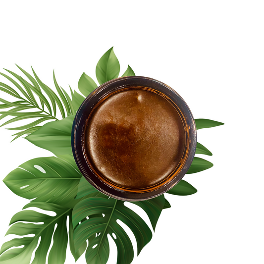 Overhead view of a brown jar surrounded by tropical leaves.

