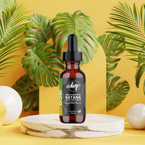 Product image of a bottle of Beauty Gate Cosmetics Wild-Harvested Batana hair and skin care oil, staged with tropical leaves, geometric shapes, and a yellow background.