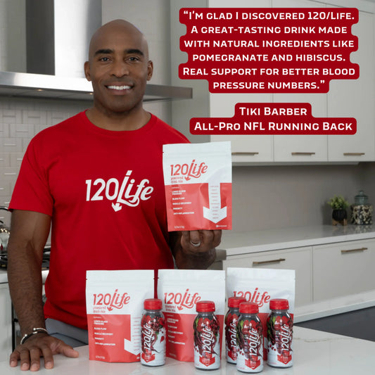Product image with Tiki Barber wearing a red T-shirt and holding a bag of 120/Life drink mix, with a red box of text quoting him. In front of him are more bags and bottles of 120/Life products.
